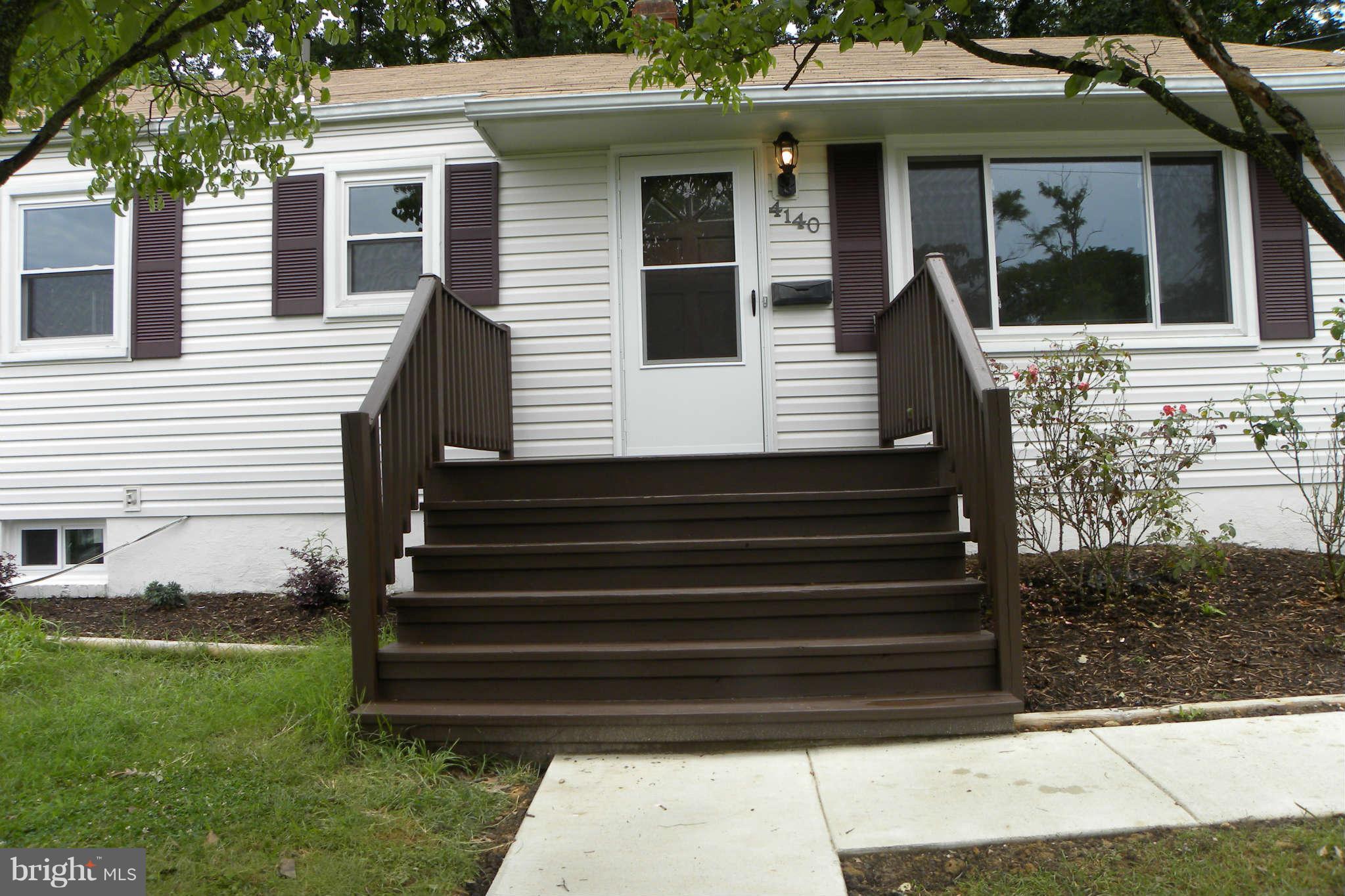 4140 Addison Road Fairfax, VA 22030 - Photo 2 of 27 a view of a house with a small garden