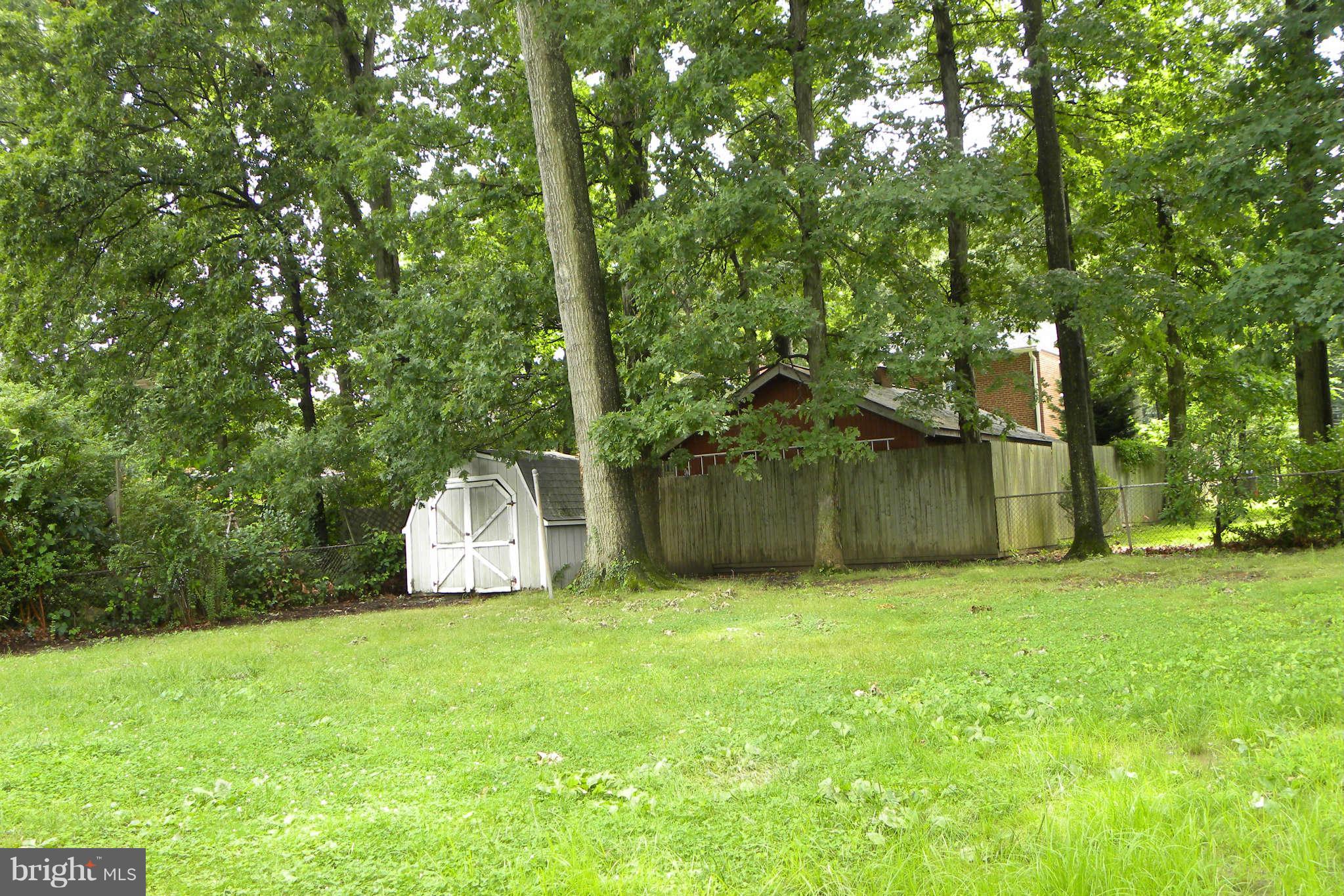 4140 Addison Road Fairfax, VA 22030 - Photo 19 of 27 a view of a field with a tree