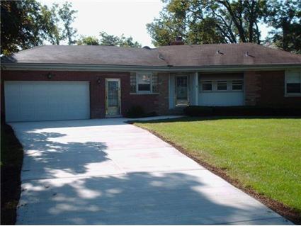 1021 Raleigh Road Glenview, IL 60025 - Photo 1 of 1 a front view of a house with a garden
