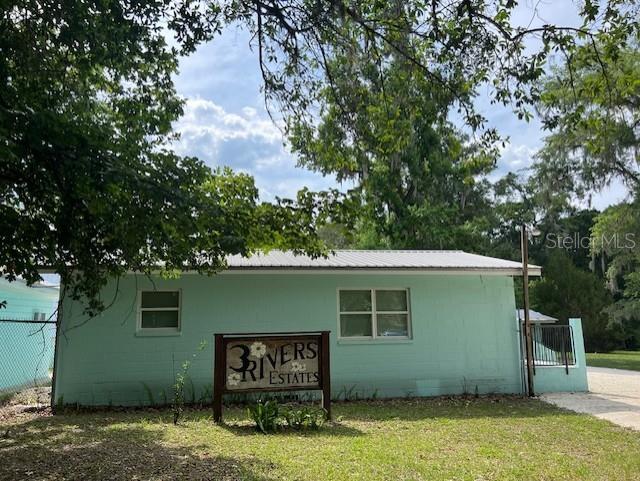 Southwest Bumble Street Fort White, FL 32038 - Photo 8 of 15 a view of a house with a yard