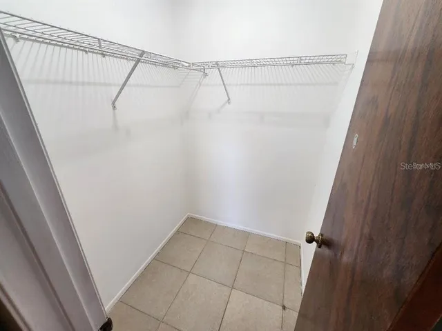 a view of a room with utility racks on the wall