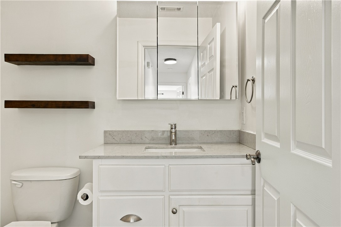 636 Lookover Drive Anderson, SC 29621 - Photo 17 of 34 Clean lines and durable stone counters define this modern bathroom vanity area.