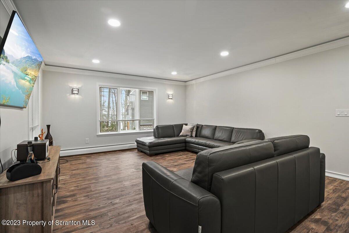 110 Chipmunk Drive Tafton, PA 18464 - Photo 11 of 60 a living room with furniture and a flat screen tv