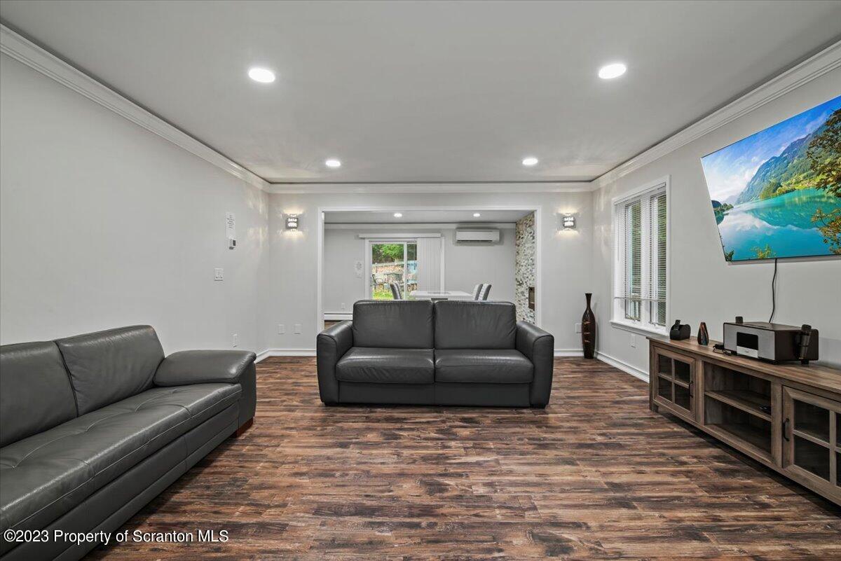 110 Chipmunk Drive Tafton, PA 18464 - Photo 12 of 60 a living room with furniture and a flat screen tv