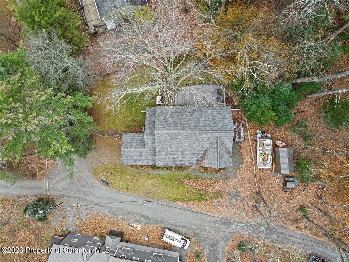 110 Chipmunk Drive Tafton, PA 18464 - Photo 2 of 60 a view of a yard and a house in the background