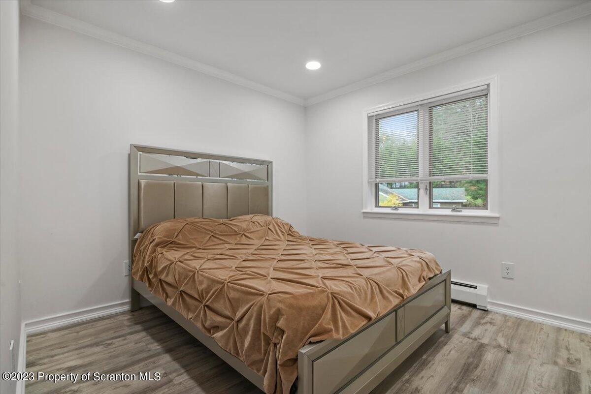 110 Chipmunk Drive Tafton, PA 18464 - Photo 28 of 60 a bed sitting in a bedroom next to a window