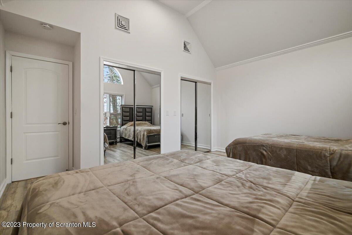 110 Chipmunk Drive Tafton, PA 18464 - Photo 33 of 60 a bedroom with a bed and chair