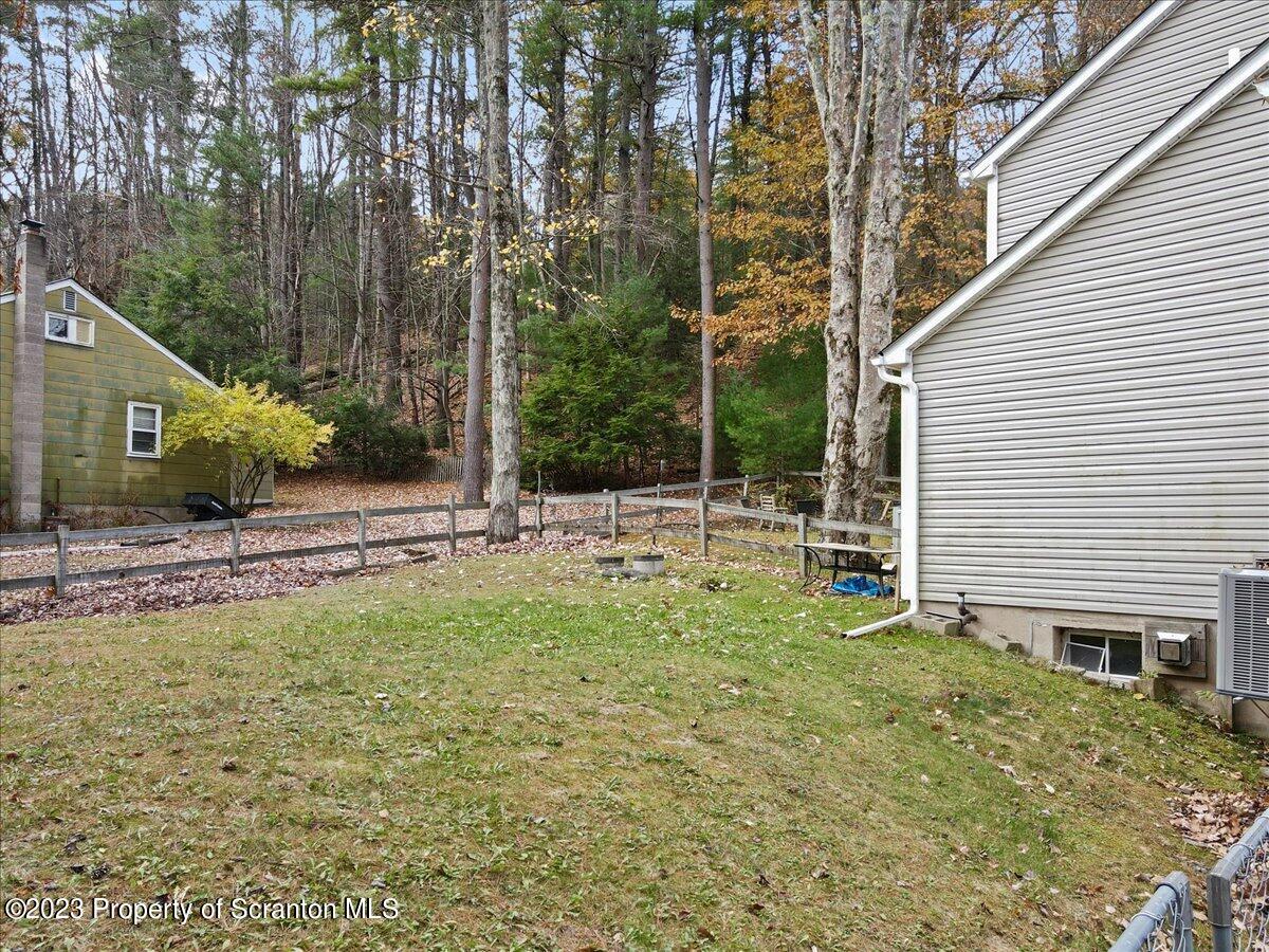 110 Chipmunk Drive Tafton, PA 18464 - Photo 55 of 60 a backyard of a house with lots of green space