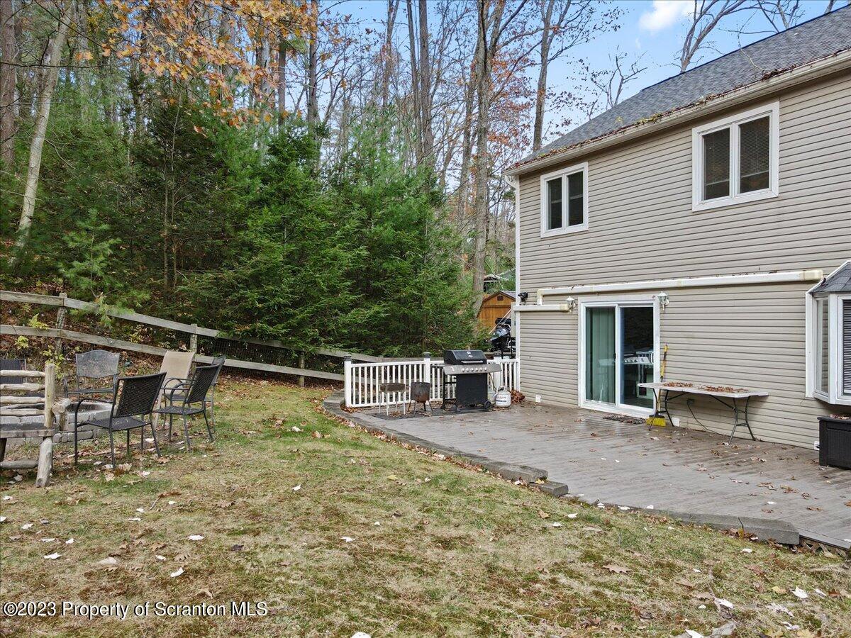 110 Chipmunk Drive Tafton, PA 18464 - Photo 57 of 60 a view of a house with a backyard and chairs