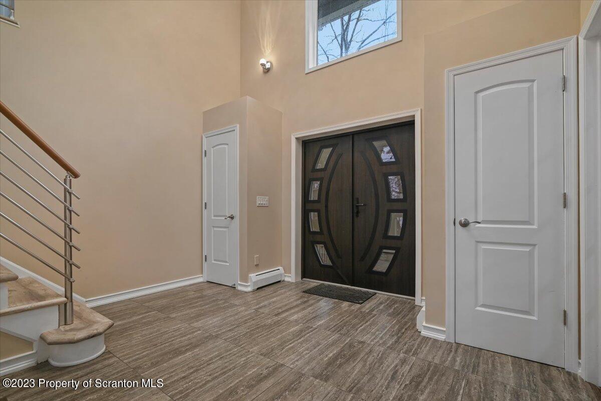 110 Chipmunk Drive Tafton, PA 18464 - Photo 8 of 60 a view of an entryway with wooden floor