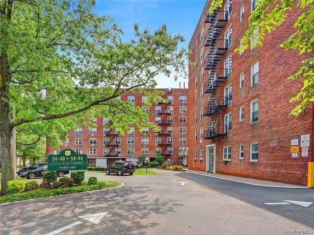 a city street lined with buildings and trees