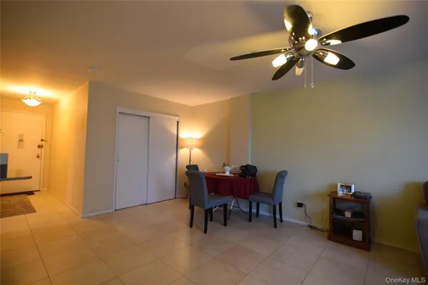 a view of a livingroom with furniture and a ceiling fan