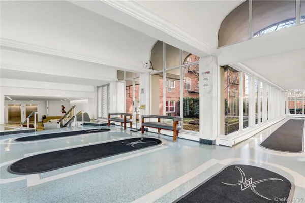 a view of lobby with furniture and large windows