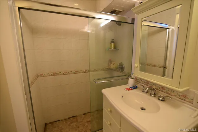 a bathroom with a sink and mirror