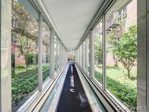 a view of balcony with yard