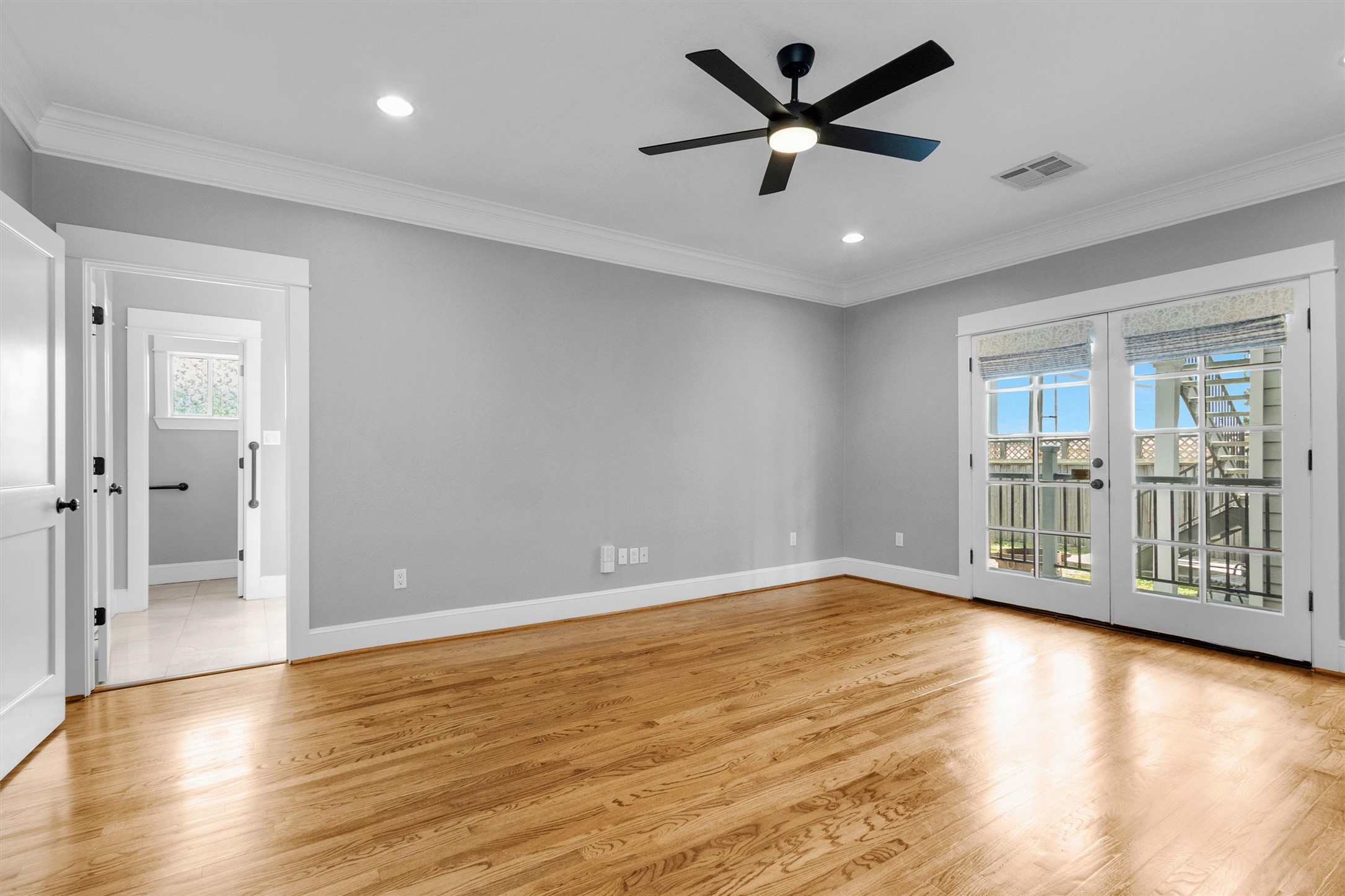 304 Vincent Street Houston, TX 77009 - Photo 25 of 36 a view of an empty room with window and wooden floor