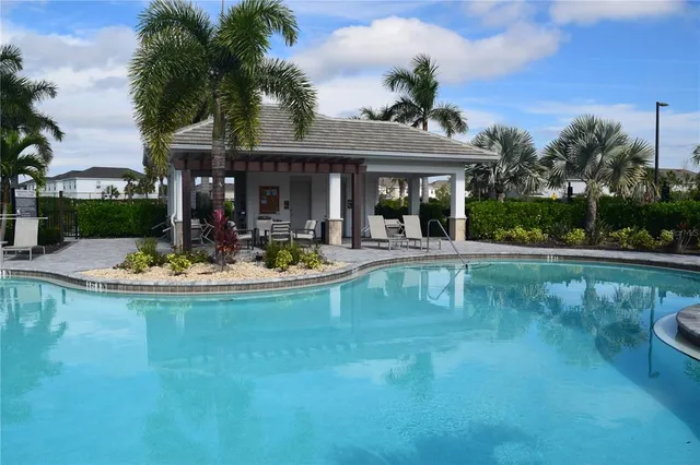 a view of a swimming pool with a table and chairs