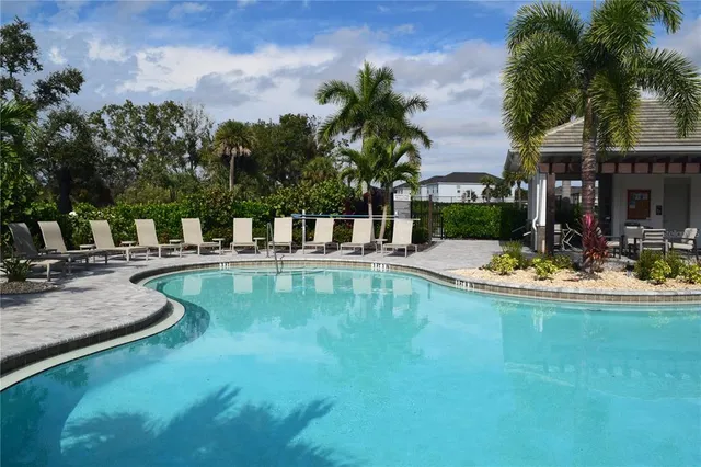a view of swimming pool with chairs