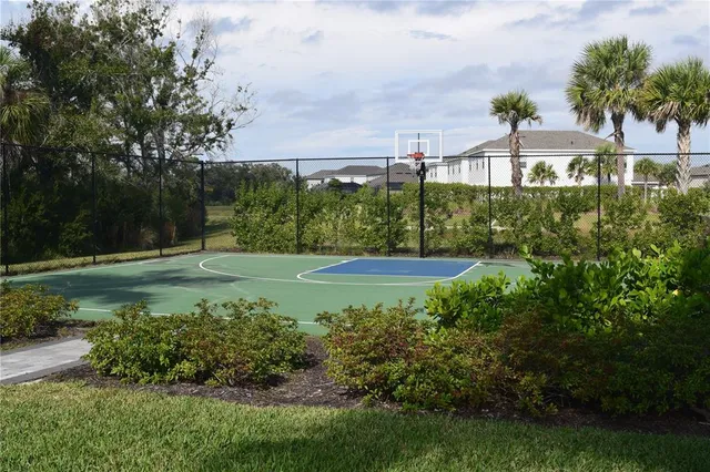 a view of a garden with a building in the background