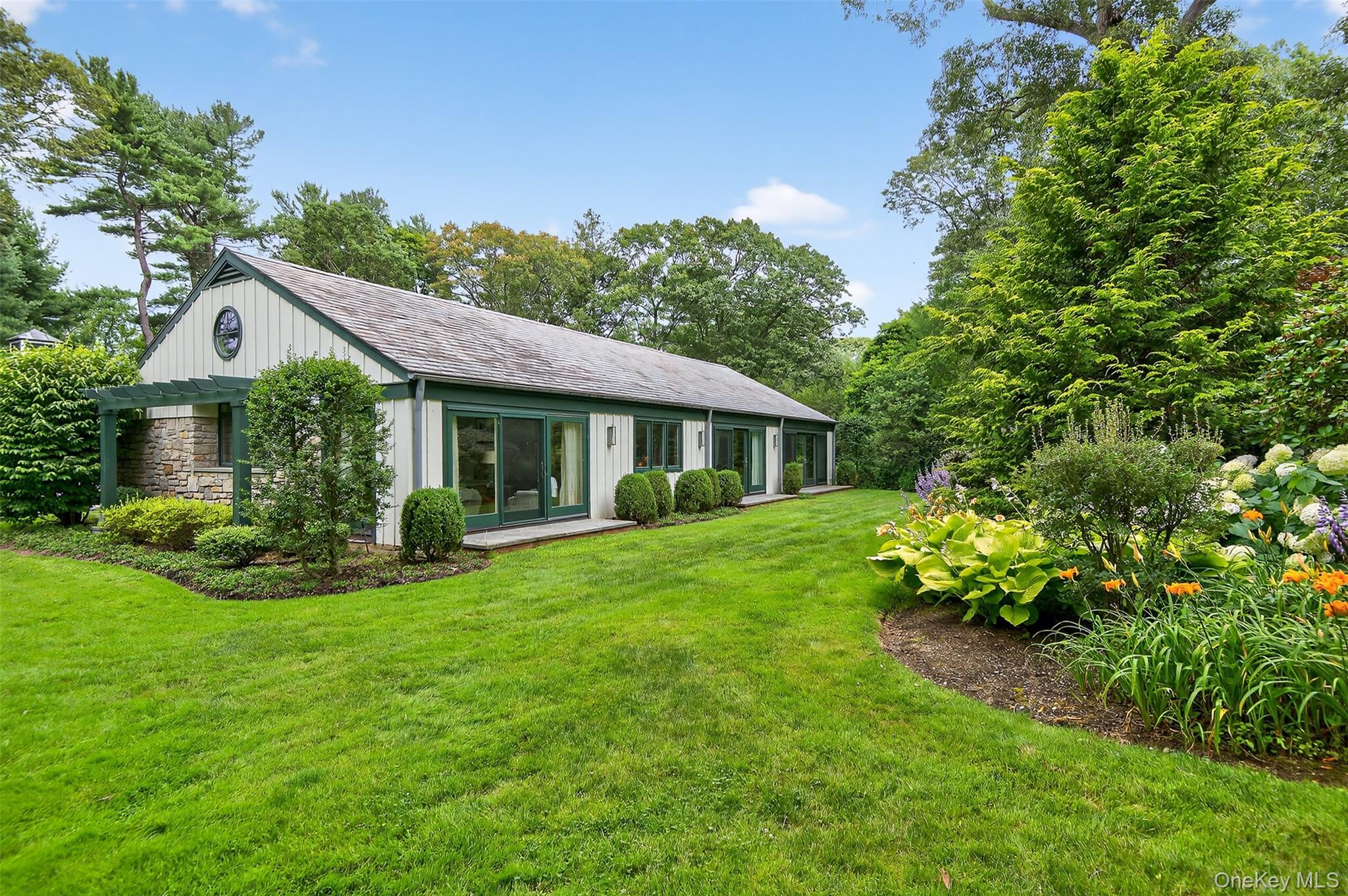 343 Chicken Valley Road Glen Head, NY 11545 - Photo 3 of 49 a front view of a house with garden
