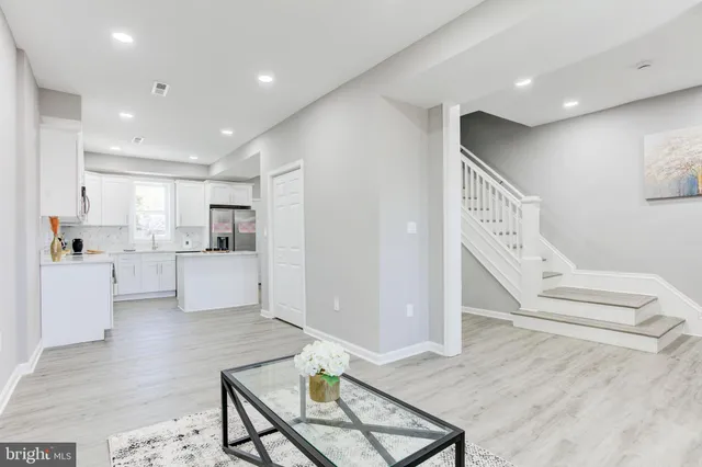a view of kitchen with furniture and wooden floor