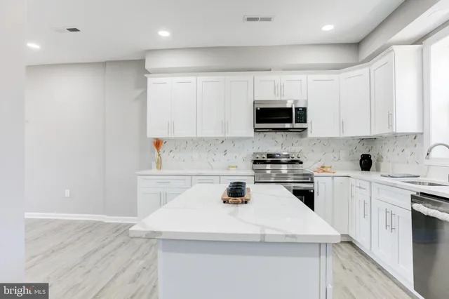 a kitchen with a stove and a sink