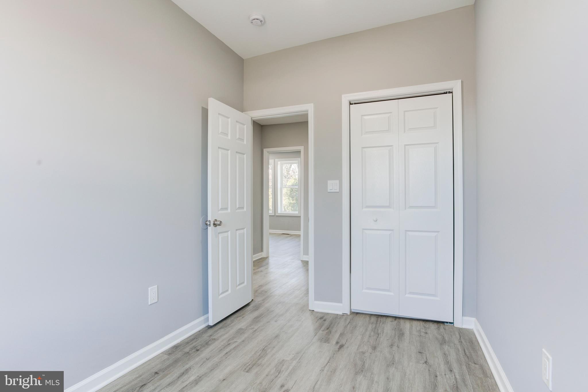 156 South Hilton Street Baltimore, MD 21229 - Photo 26 of 39 an empty room with wooden floor and closet