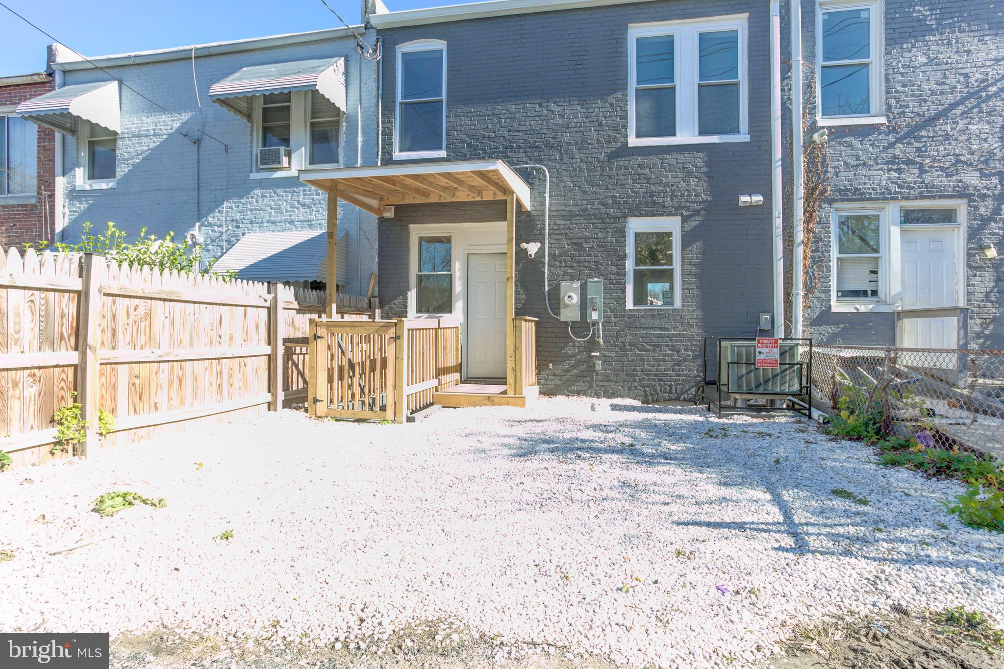 156 South Hilton Street Baltimore, MD 21229 - Photo 39 of 39 a view of a brick house with many windows