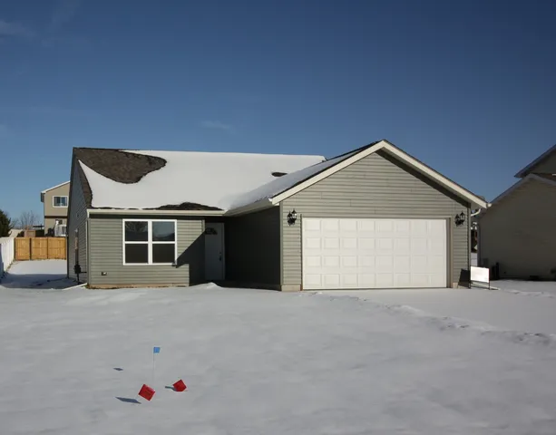 a view of house with garage