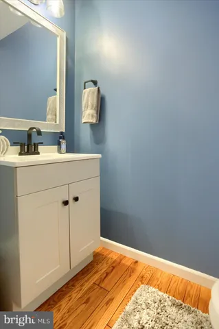 a room with a sink and a mirror