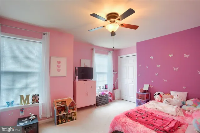 a bedroom with furniture and a chandelier
