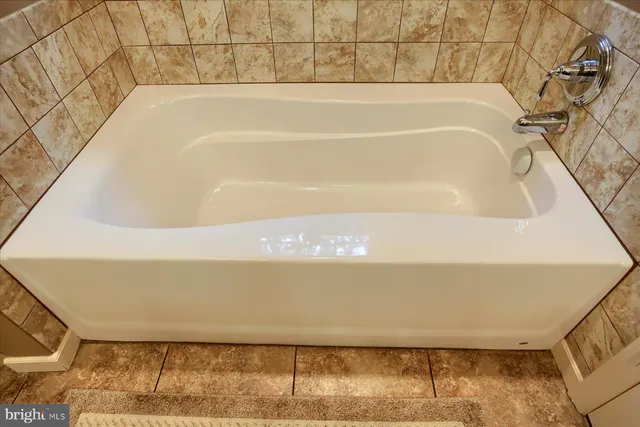 a bathroom with a bath tub