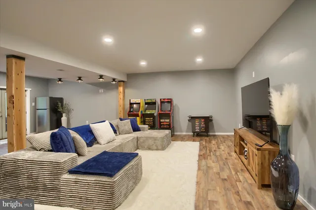 a bedroom with furniture and a flat screen tv