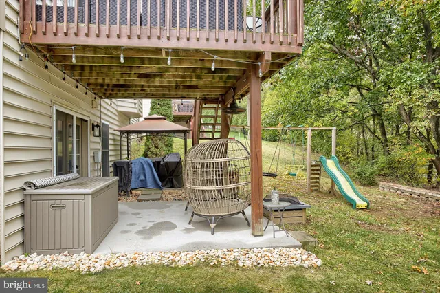 a view of a chairs and table in the patio