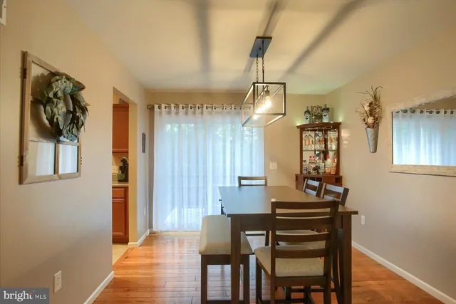 a view of a dining room with furniture and window