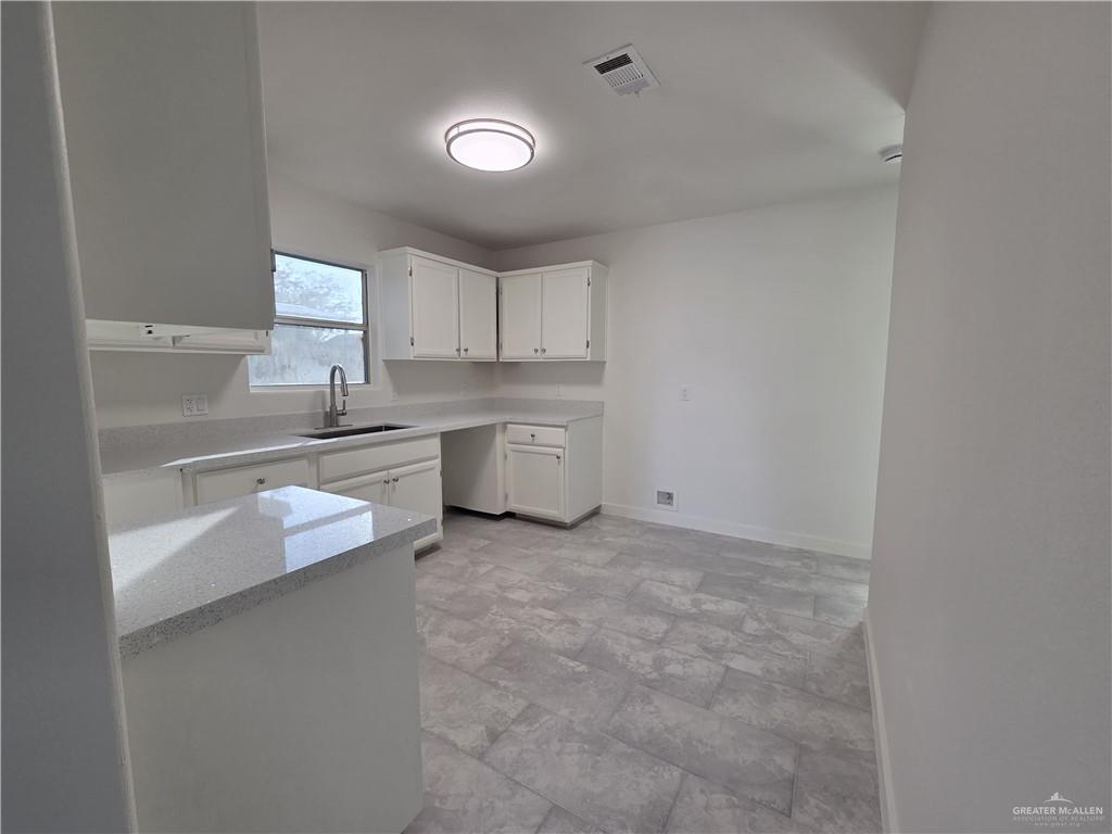 477 Serg Loop Alamo, TX 78516 - Photo 4 of 15 a kitchen with a sink stove and cabinets