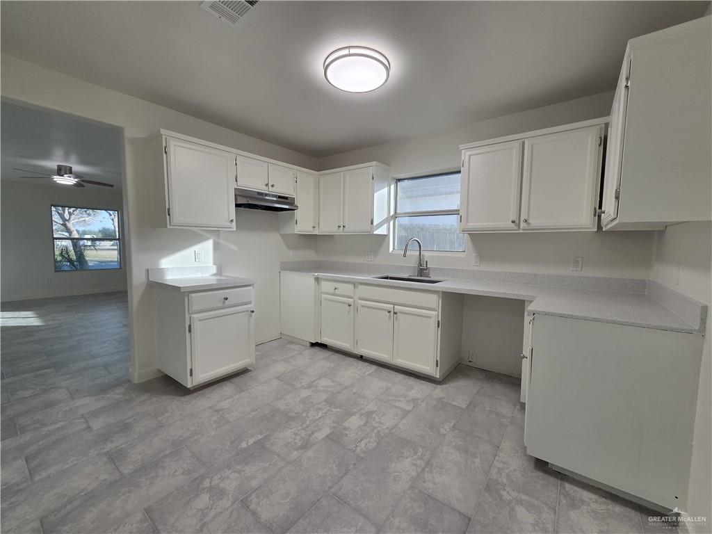 477 Serg Loop Alamo, TX 78516 - Photo 5 of 15 a kitchen with stainless steel appliances a sink stove and cabinets