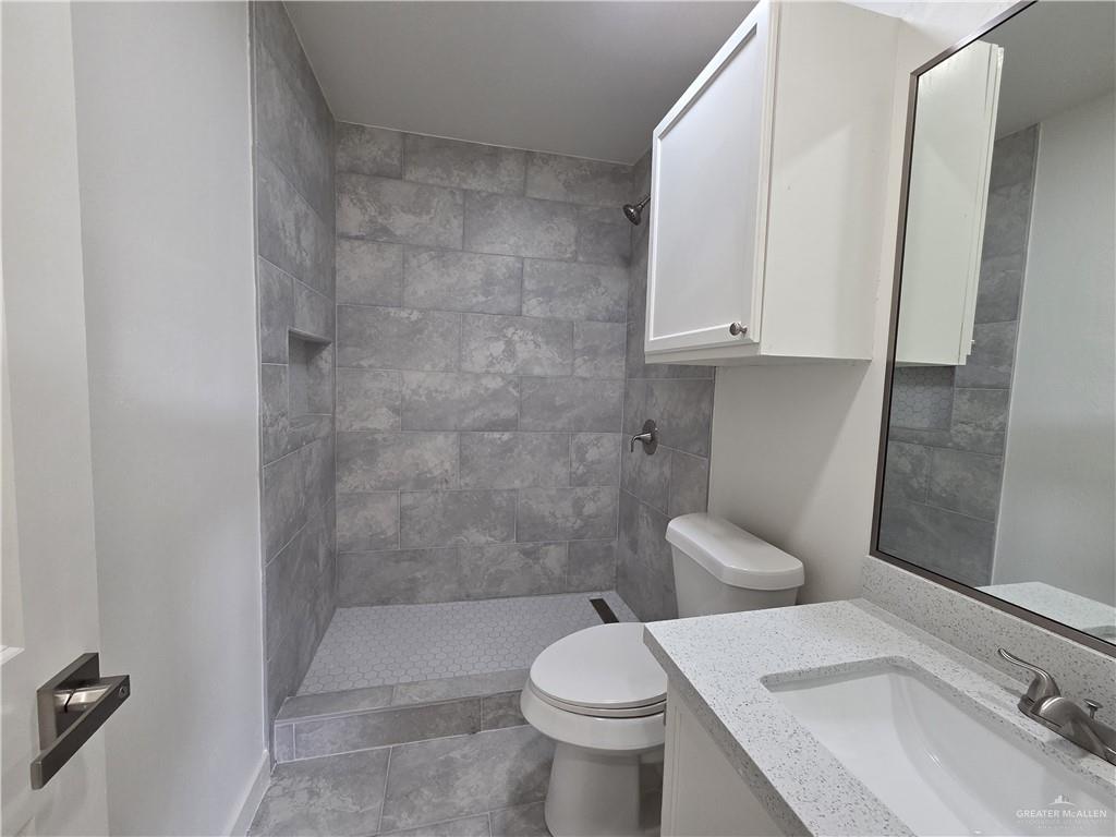 477 Serg Loop Alamo, TX 78516 - Photo 6 of 15 a bathroom with a sink a toilet and shower