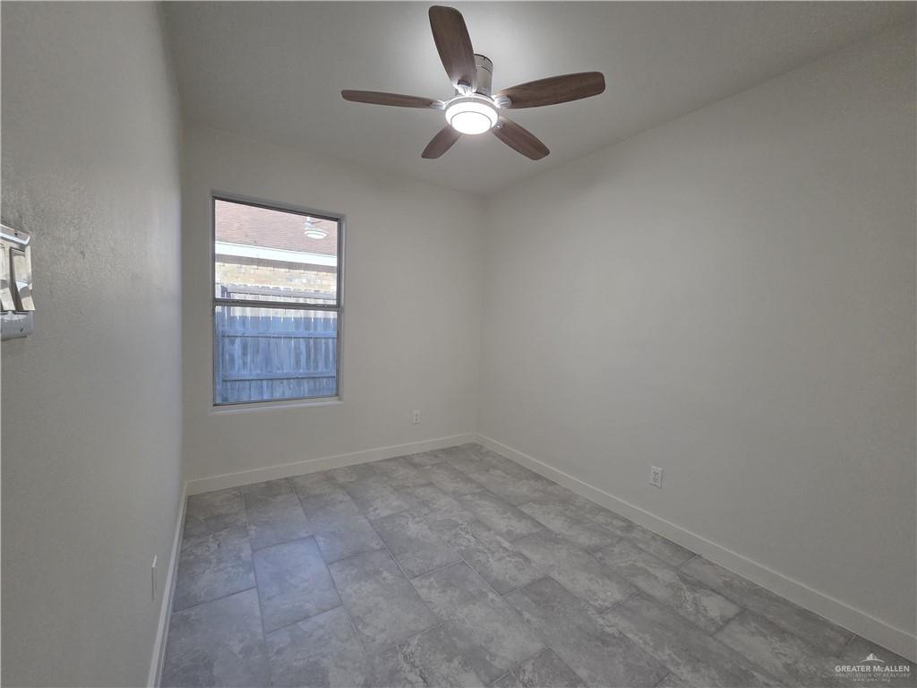 477 Serg Loop Alamo, TX 78516 - Photo 8 of 15 an empty room with closet and windows