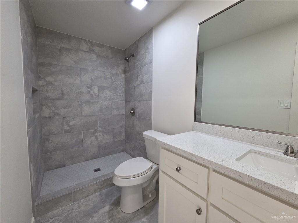 477 Serg Loop Alamo, TX 78516 - Photo 10 of 15 a bathroom with a sink a toilet and shower
