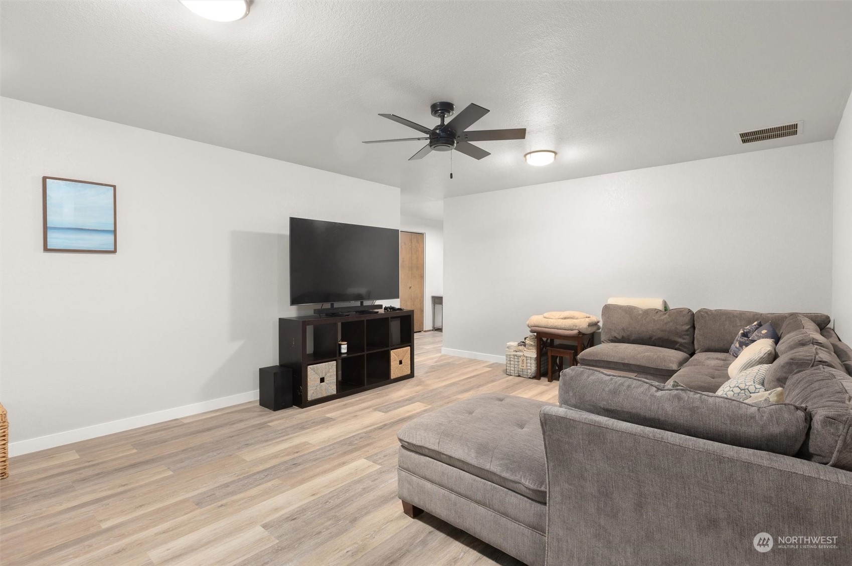 11 170th Place Southeast Bothell, WA 98012 - Photo 12 of 29 a living room with furniture and a flat screen tv