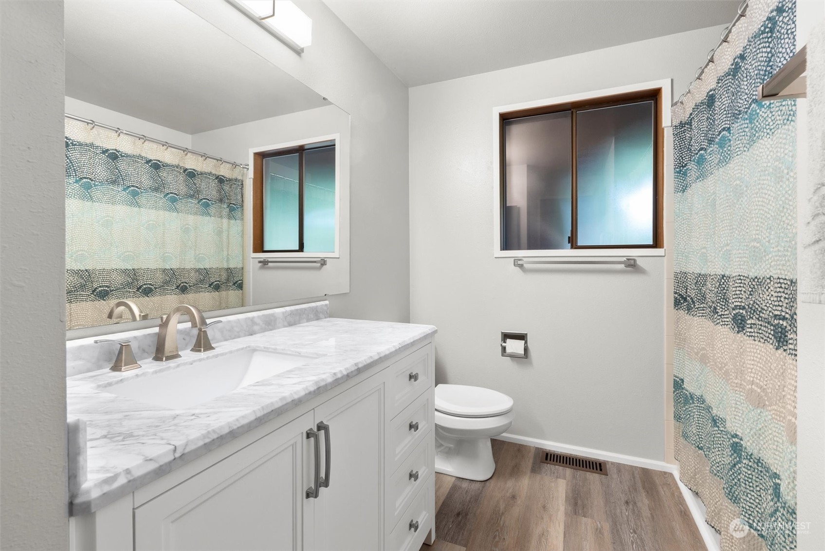 11 170th Place Southeast Bothell, WA 98012 - Photo 13 of 29 a bathroom with a granite countertop sink toilet and mirror
