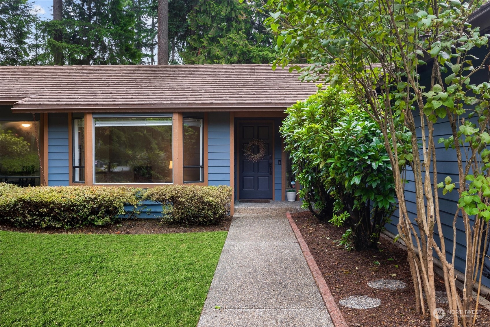 11 170th Place Southeast Bothell, WA 98012 - Photo 2 of 29 a front view of a house with a garden