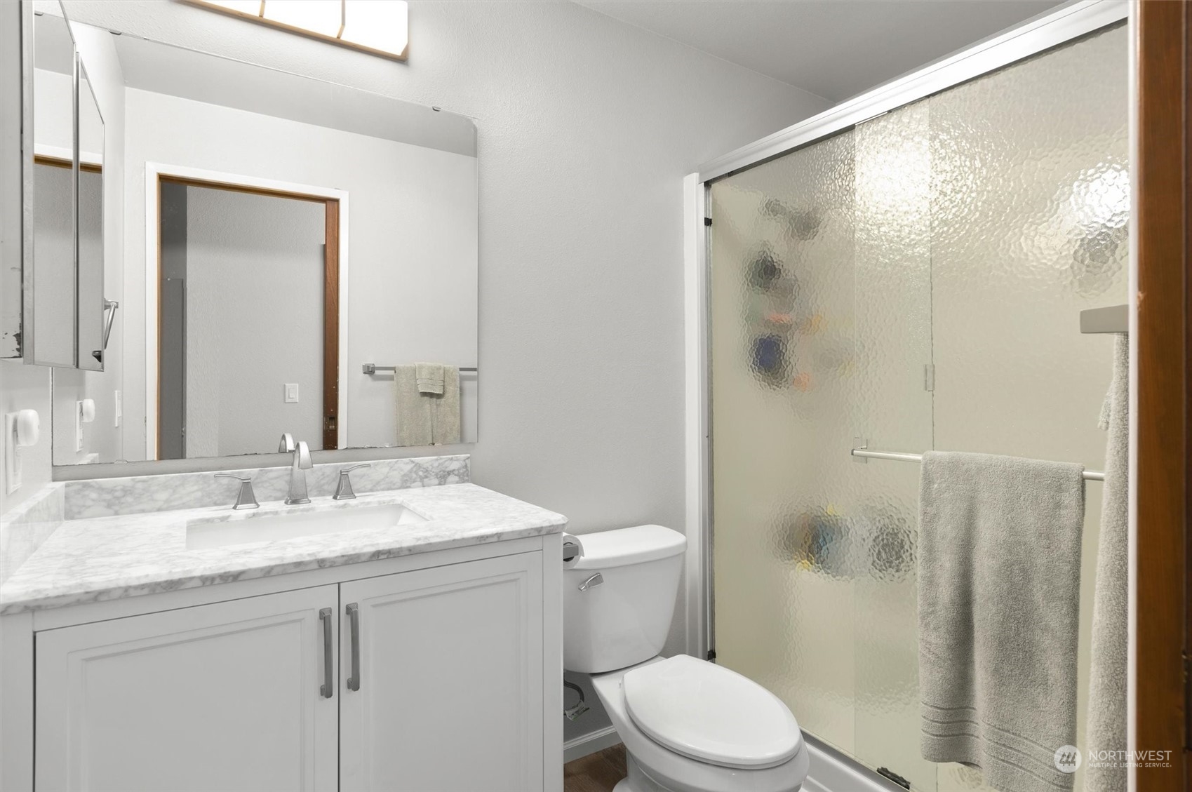 11 170th Place Southeast Bothell, WA 98012 - Photo 21 of 29 a bathroom with a granite countertop sink toilet and shower