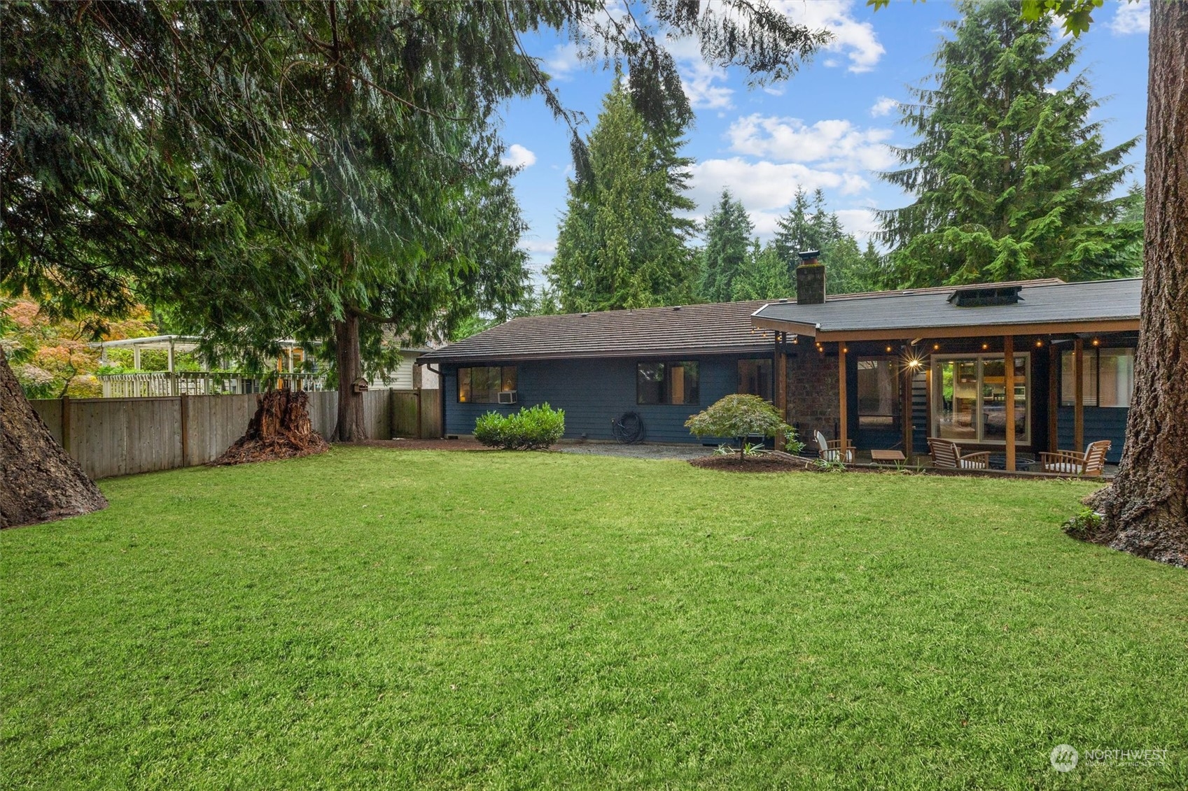 11 170th Place Southeast Bothell, WA 98012 - Photo 26 of 29 a front view of a house with a yard and trees