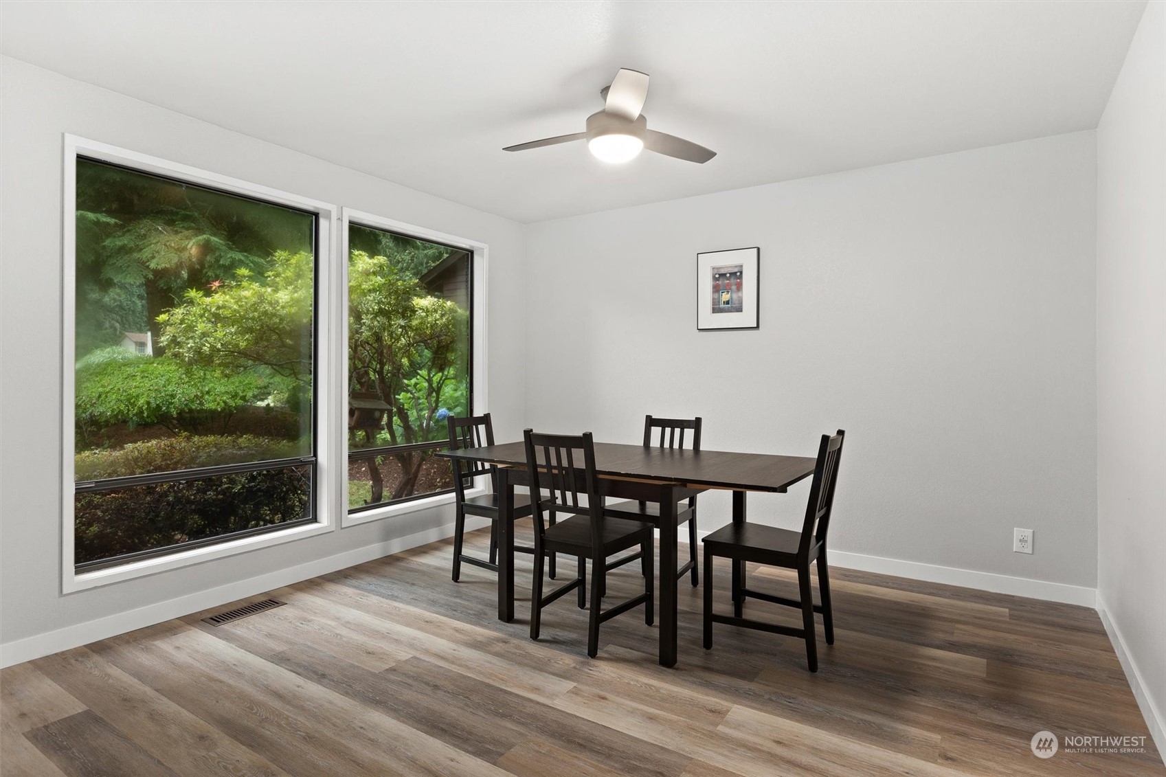 11 170th Place Southeast Bothell, WA 98012 - Photo 5 of 29 a view of a dining room with furniture window and wooden floor