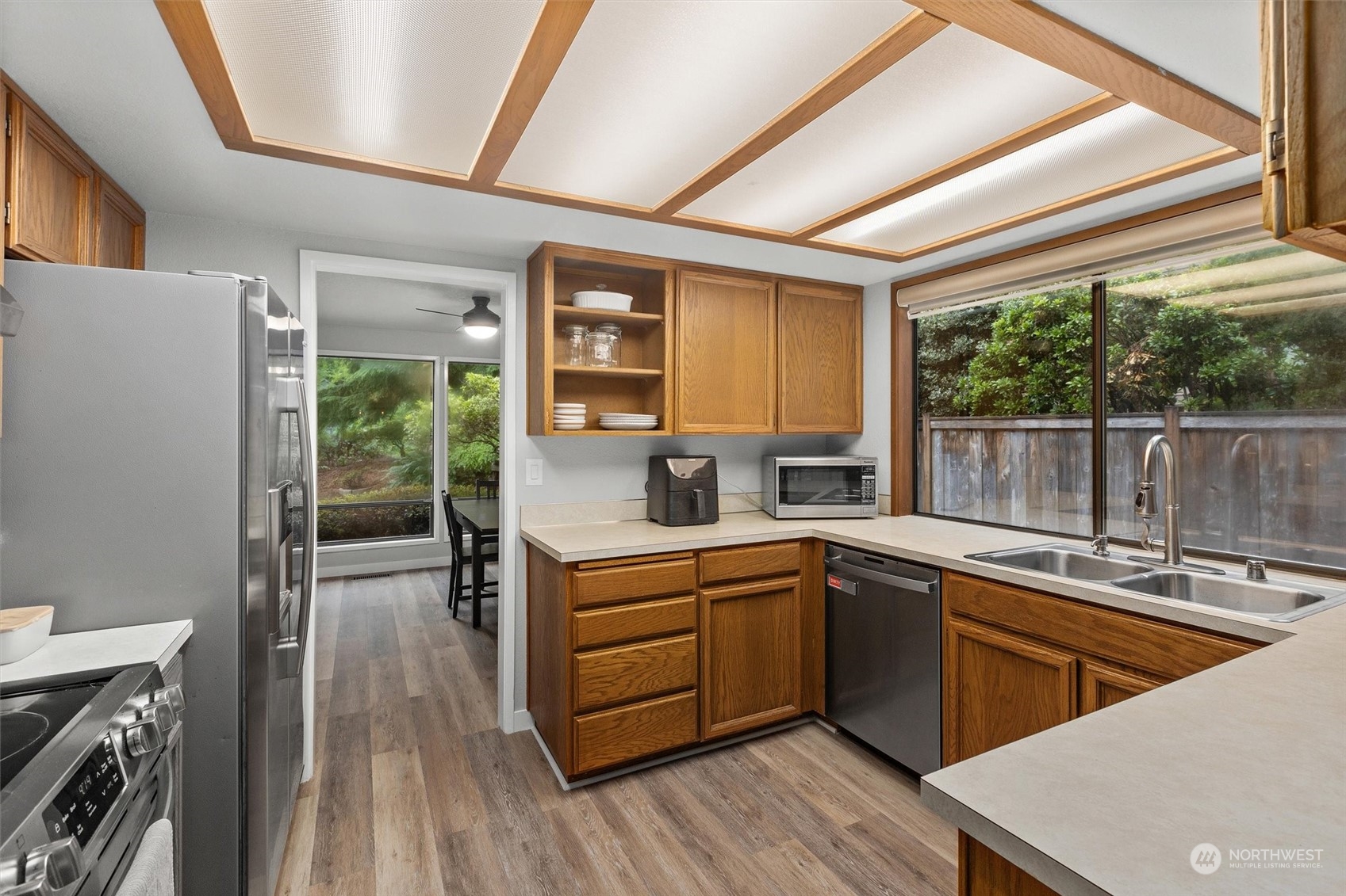 11 170th Place Southeast Bothell, WA 98012 - Photo 6 of 29 a kitchen with a sink stove and cabinets