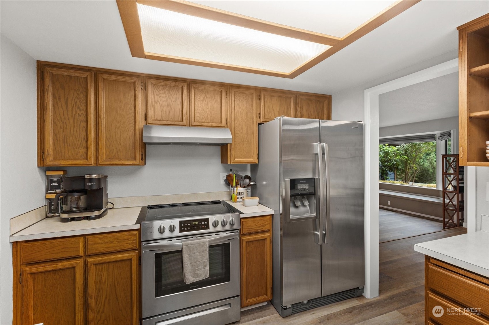 11 170th Place Southeast Bothell, WA 98012 - Photo 7 of 29 a kitchen with stainless steel appliances granite countertop a refrigerator and a stove