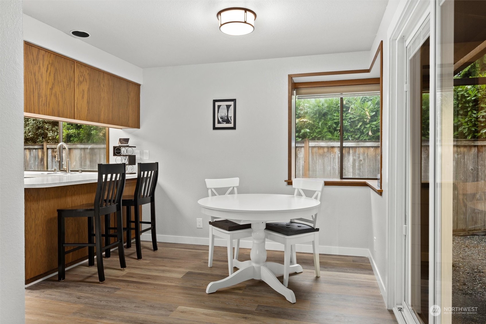 11 170th Place Southeast Bothell, WA 98012 - Photo 9 of 29 a view of a dining room with furniture window and wooden floor
