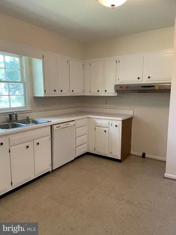 a view of cabinets and window